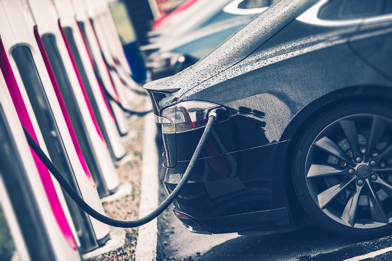 Electric Cars Charging Station Closeup Photo. Vehicle Rechargeable Batteries Charing. Future of Transportation.